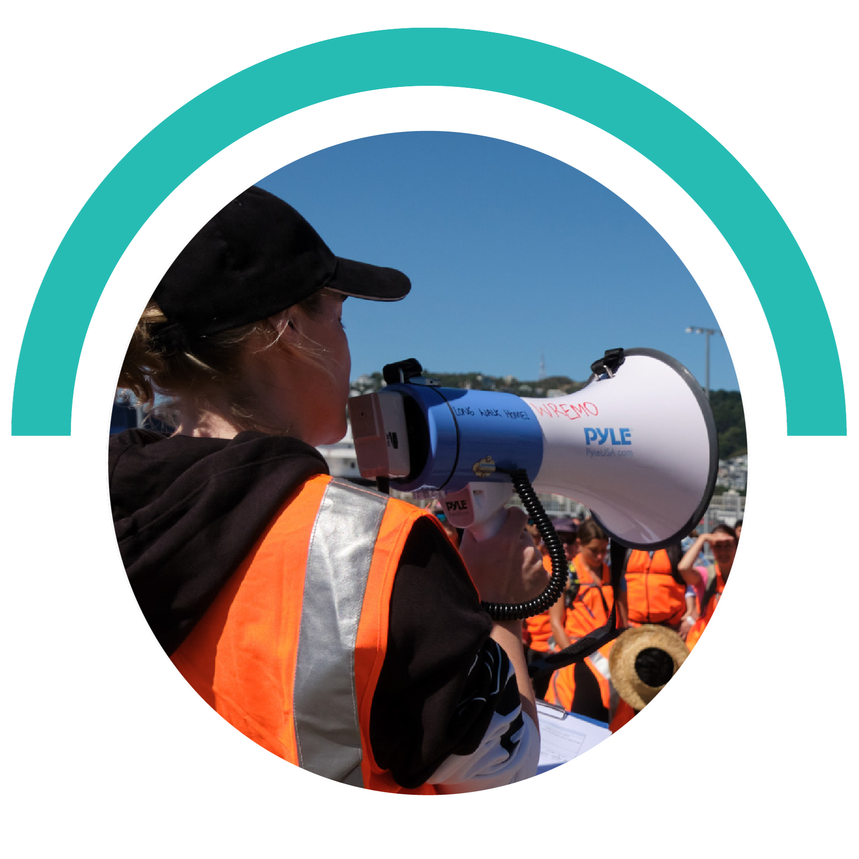 Woman in a high-vis vest holding a megaphone